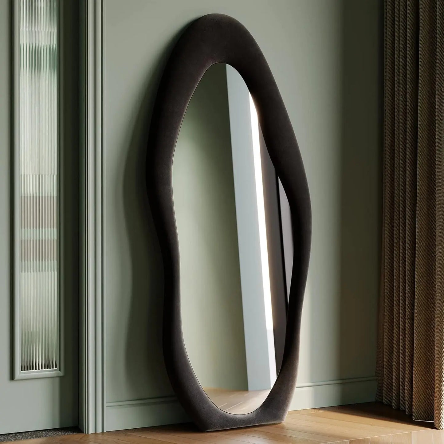 Full-length irregular wave mirror hanging or leaning against the wall. 63 x 24"