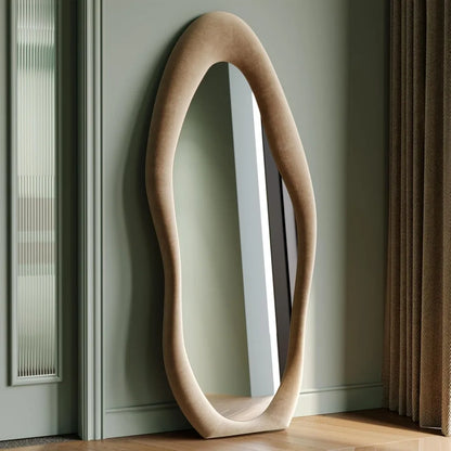 Full-length irregular wave mirror hanging or leaning against the wall. 63 x 24"