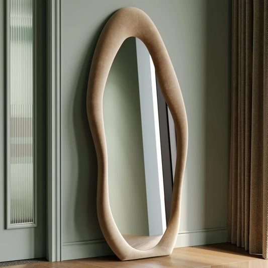 Full-length irregular wave mirror hanging or leaning against the wall. 63 x 24"