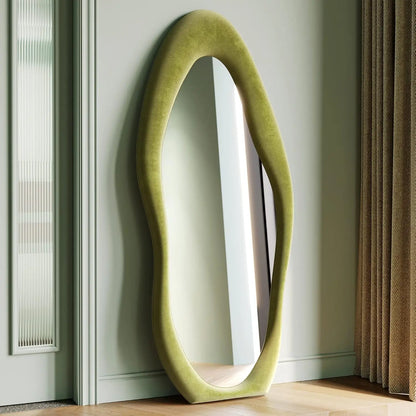 Full-length irregular wave mirror hanging or leaning against the wall. 63 x 24"