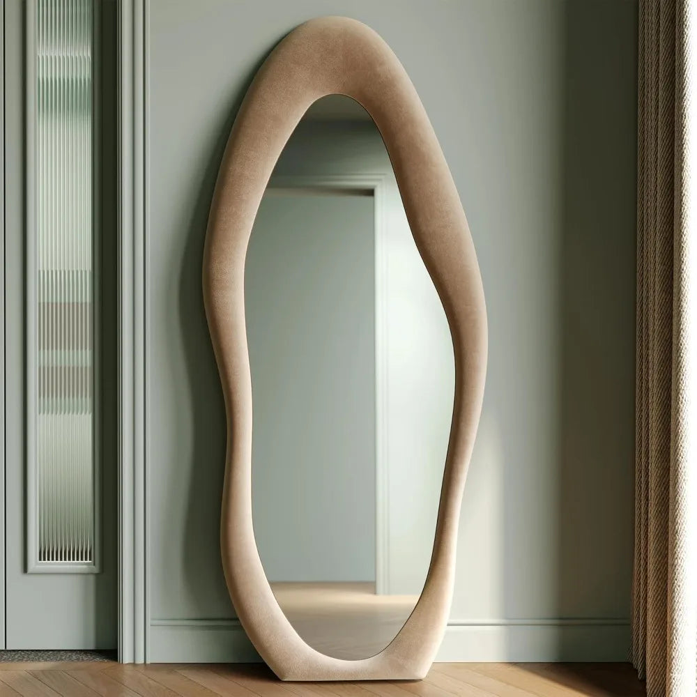 Full-length irregular wave mirror hanging or leaning against the wall. 63 x 24"