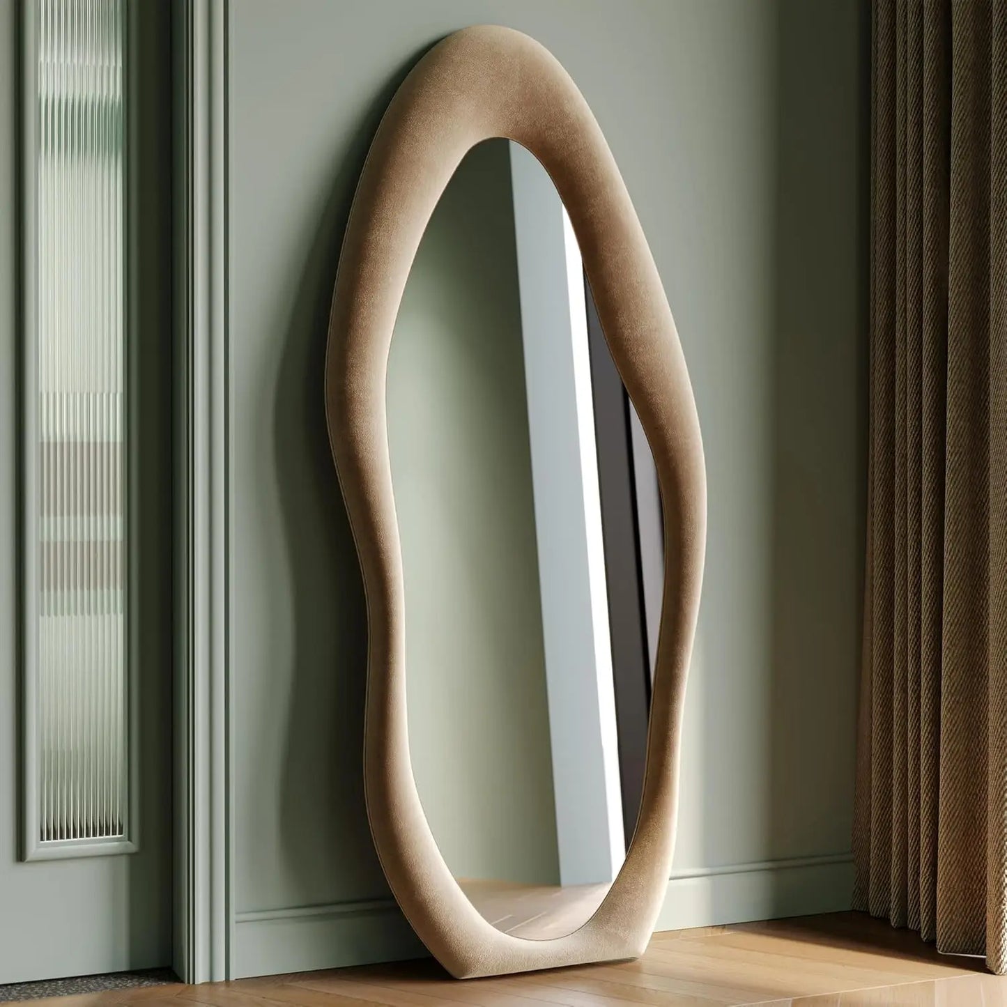 Full-length irregular wave mirror hanging or leaning against the wall. 63 x 24"