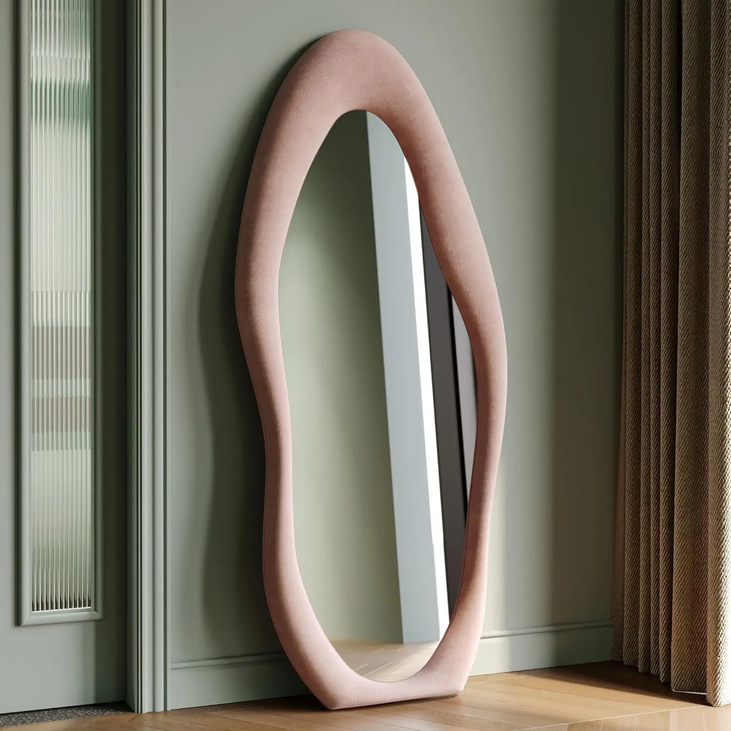 Full-length irregular wave mirror hanging or leaning against the wall. 63 x 24"