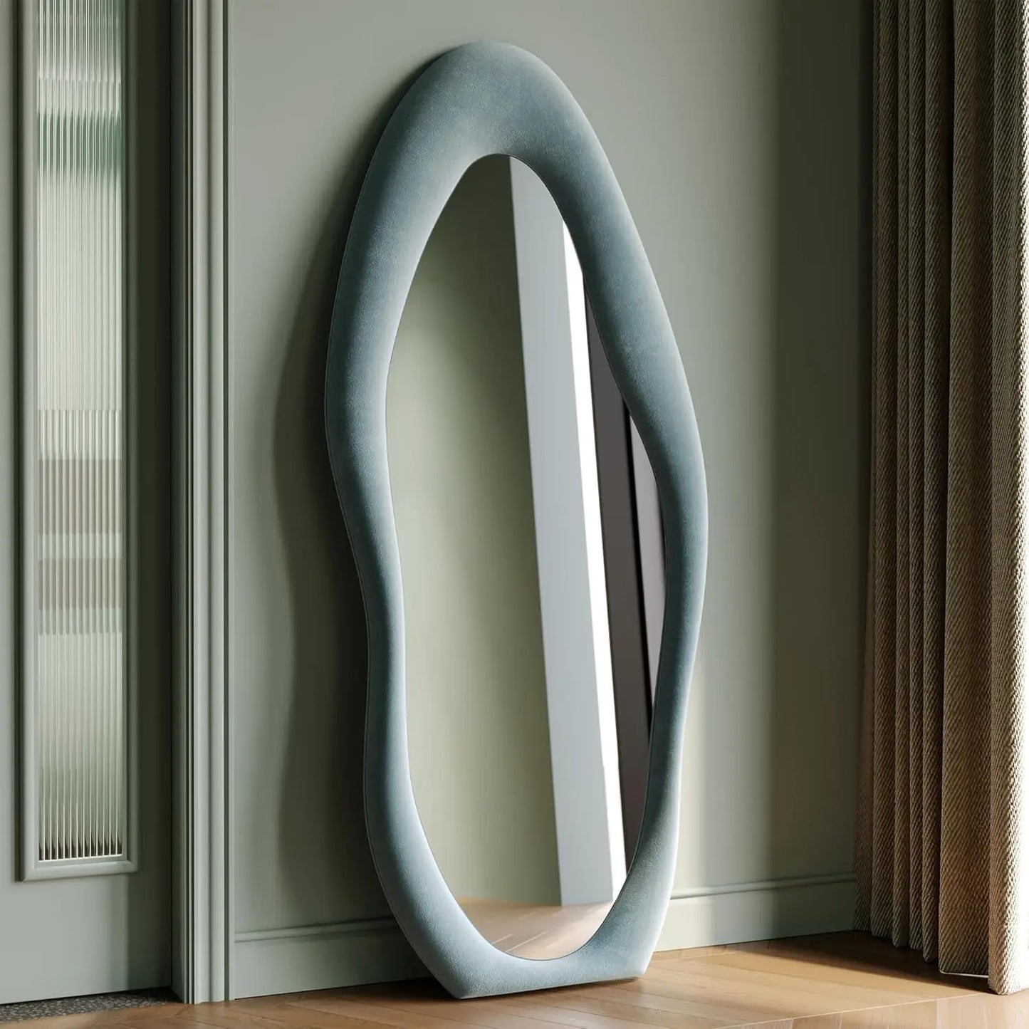 Full-length irregular wave mirror hanging or leaning against the wall. 63 x 24"